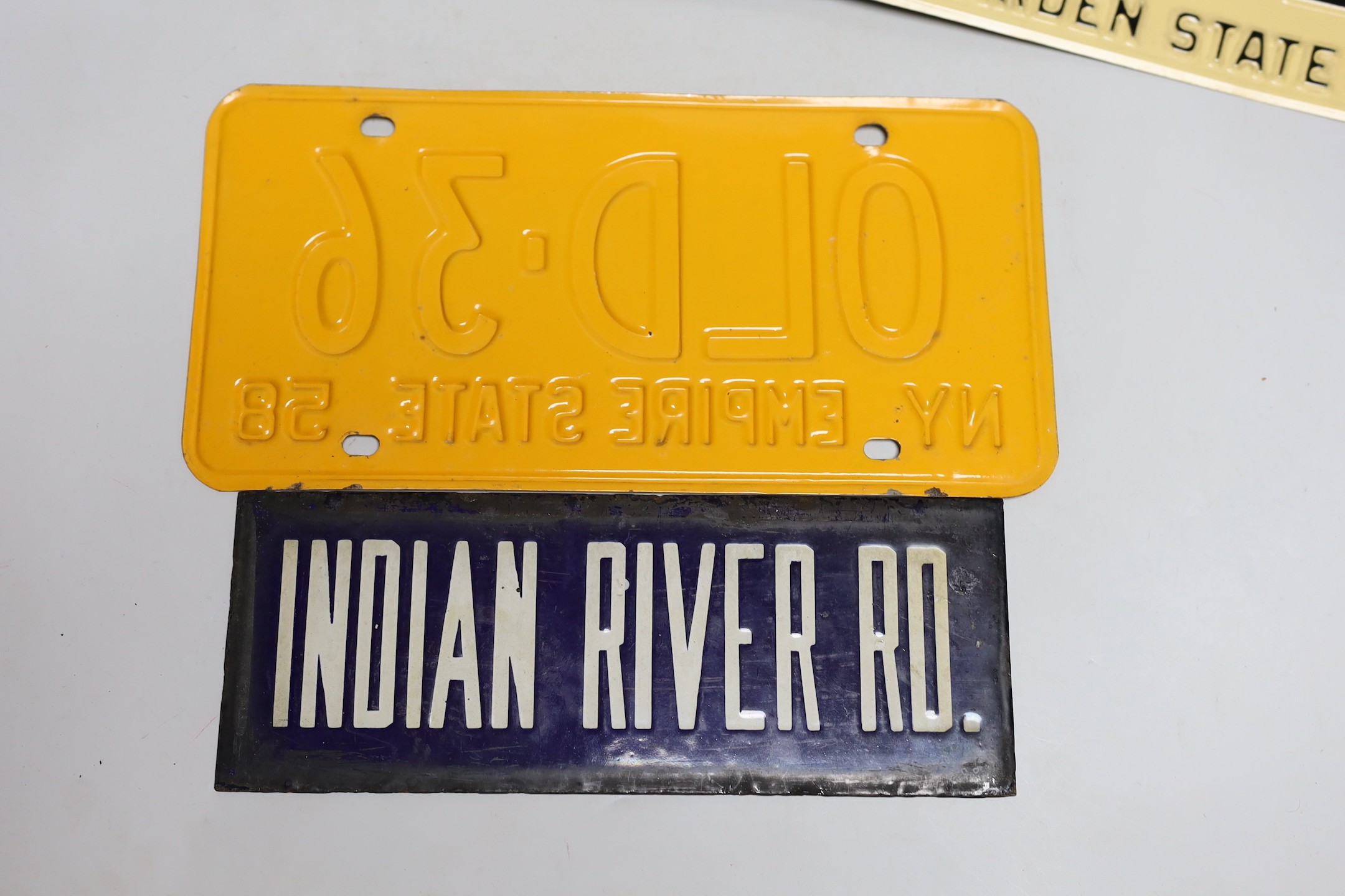 A mixed group of nine USA enamel car registration number plates
